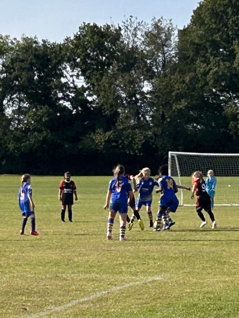 football fever united playing a game on a grass pitch